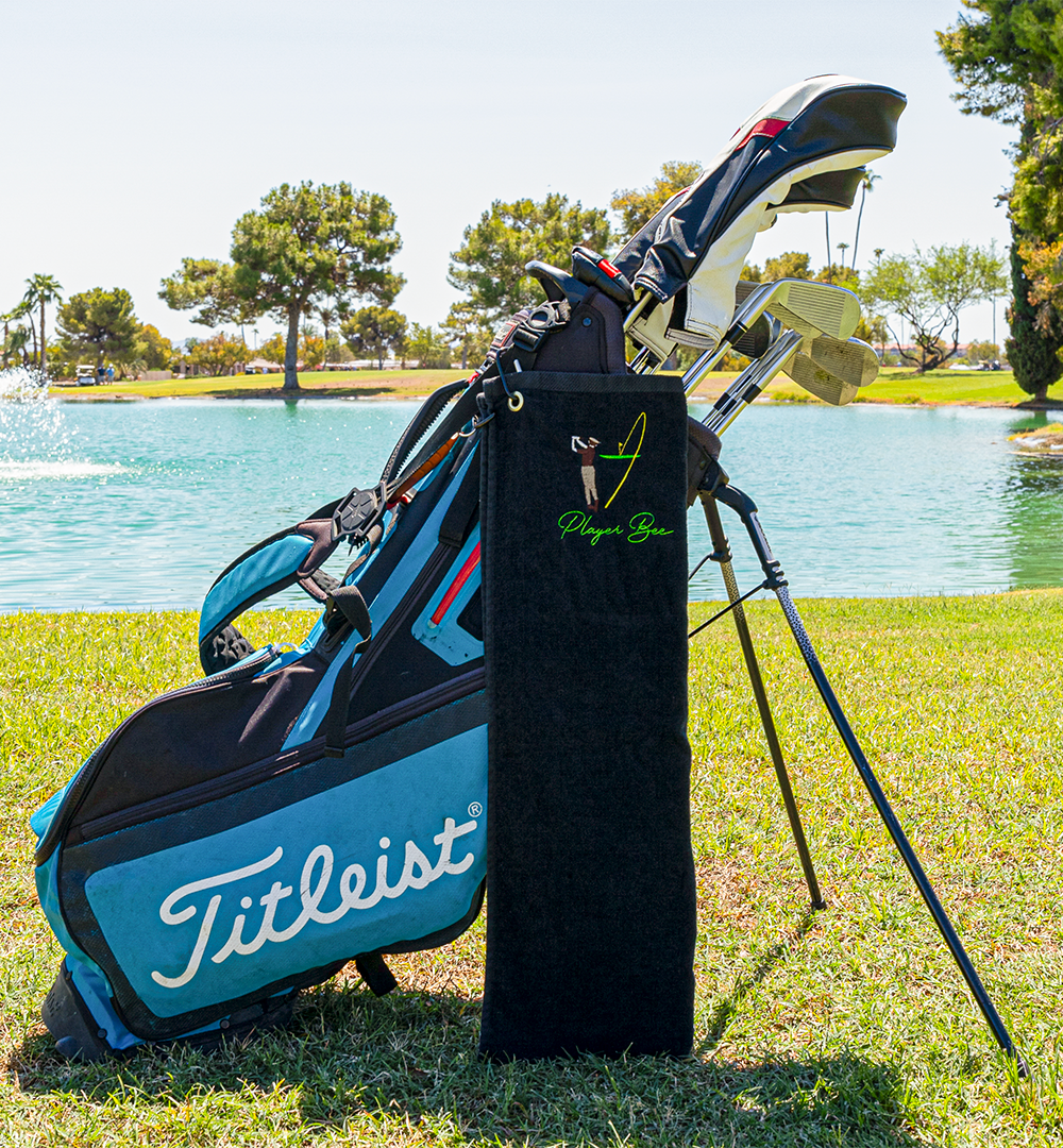 black golf towel on golf bag