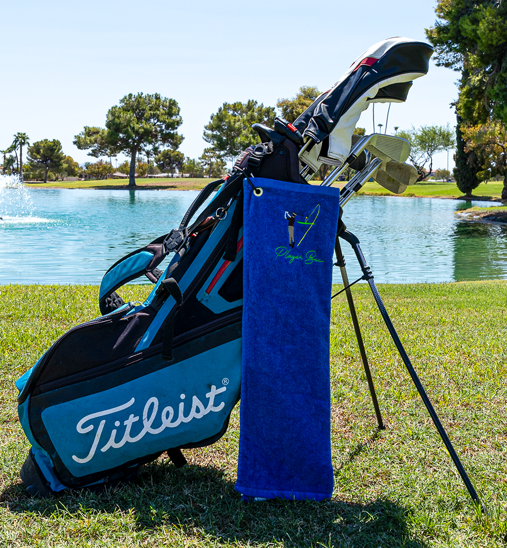 blue golf towel with logo on golf bag