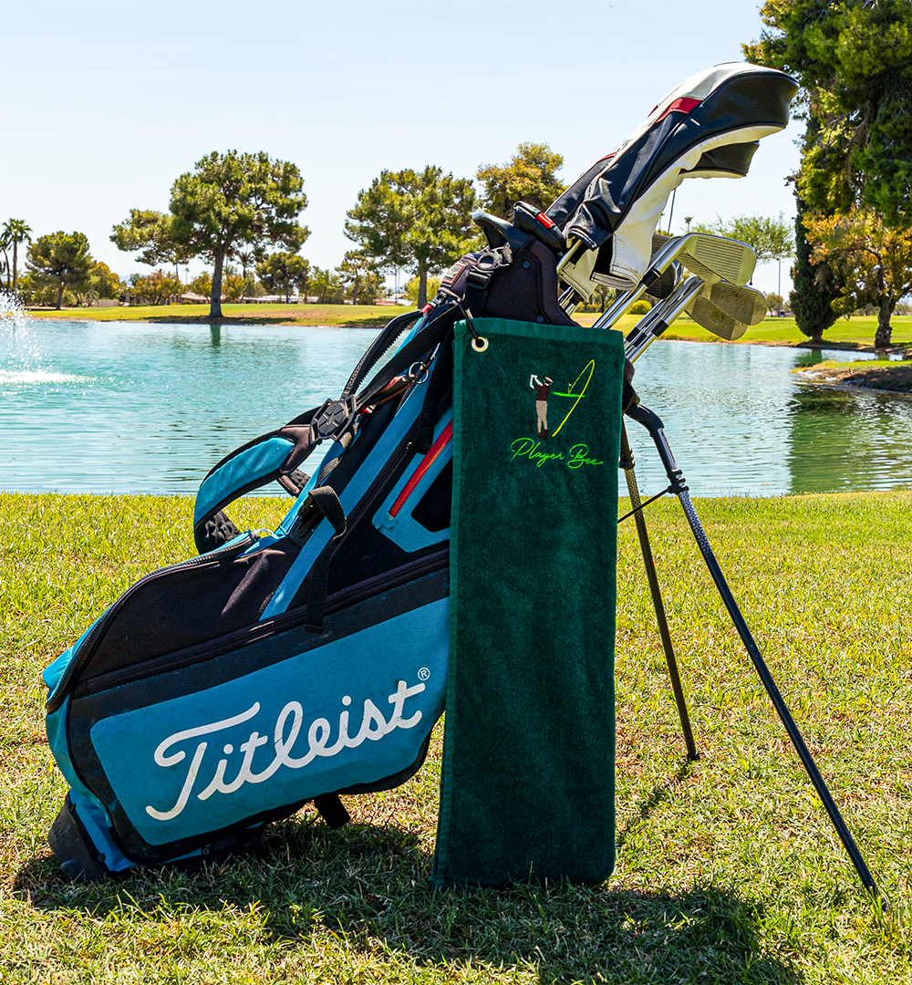 green golf towel with logo on golf bag