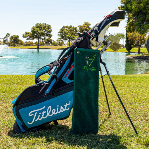 green golf towel with logo on golf bag