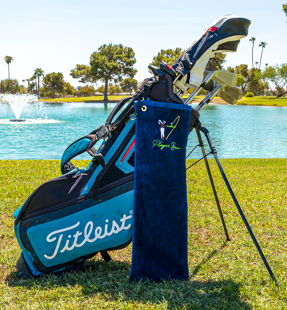 navy golf towel with logo on golf bag