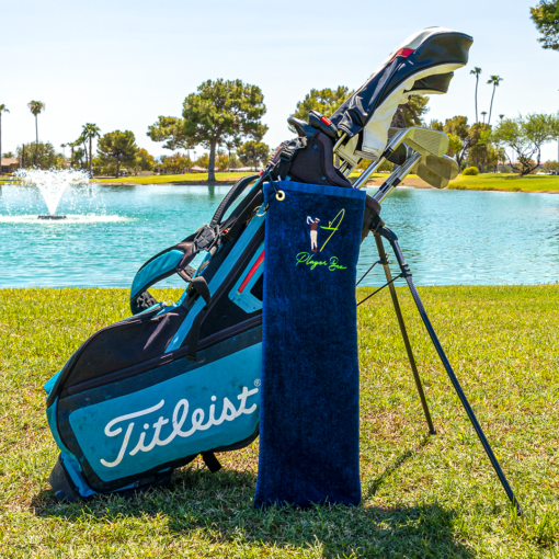 navy golf towel with logo on golf bag