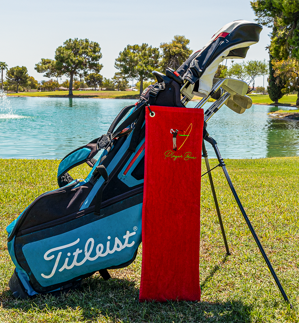 red golf towel with logo on golf bag